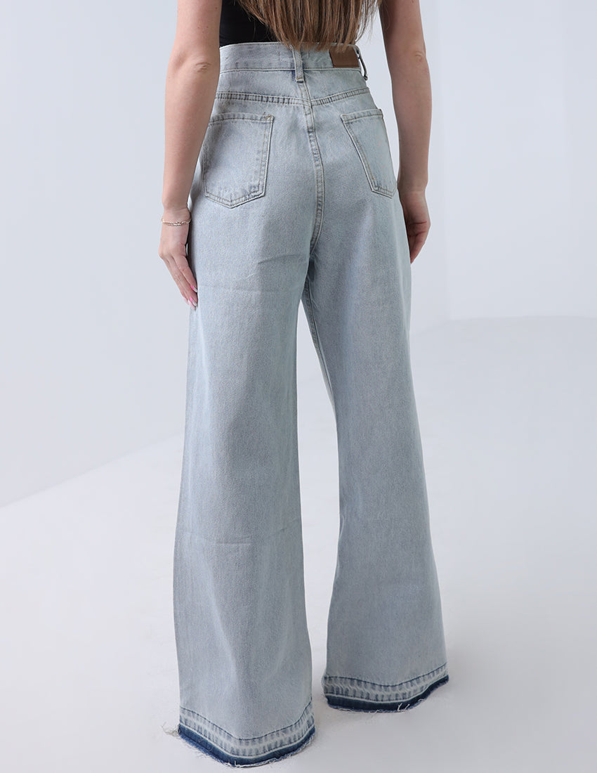 High-waisted wide leg jeans, blue with a dark blue hem.