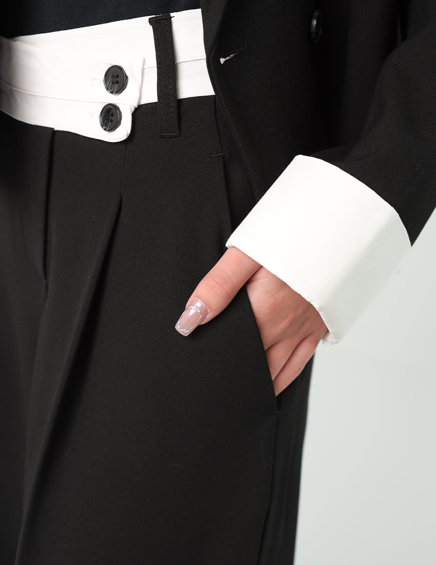 بدلة رسمية مع سترة مزدوجة الصدر وبنطلون واسع الساقين