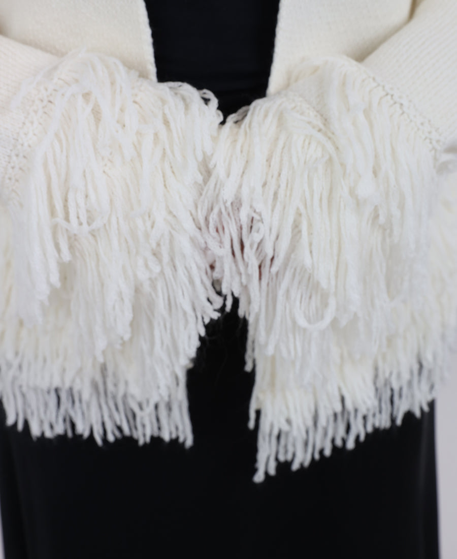Knitted blouse with tassels