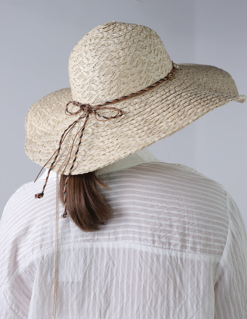 Beige priest's hat with eye patch