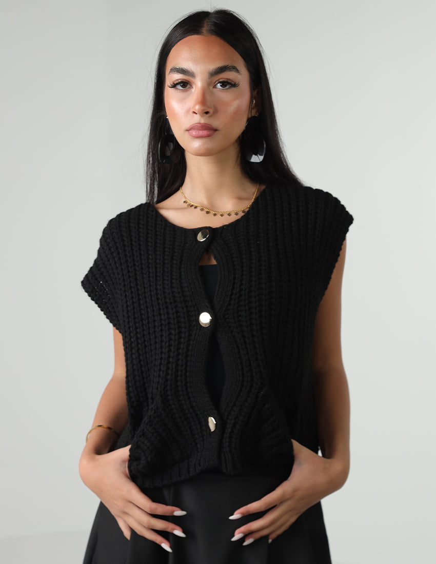 سترة صوفية بأكمام قصيرة وأزرار وجيوب