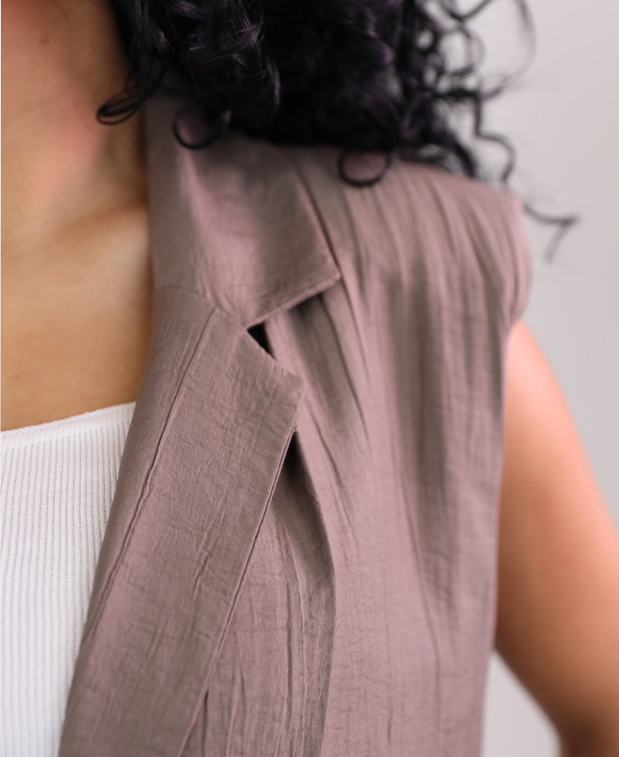 Long vest with golden button