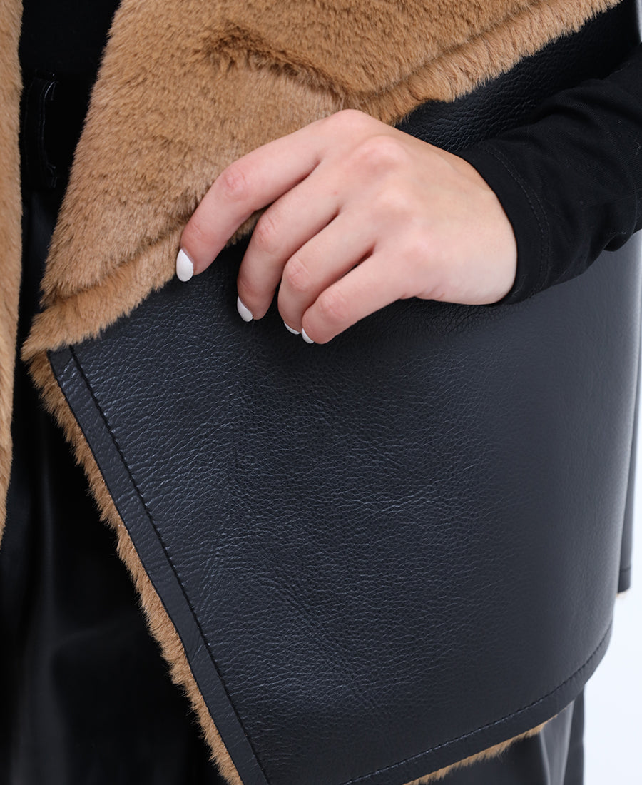 Leather vest on the outside and fur on the inside