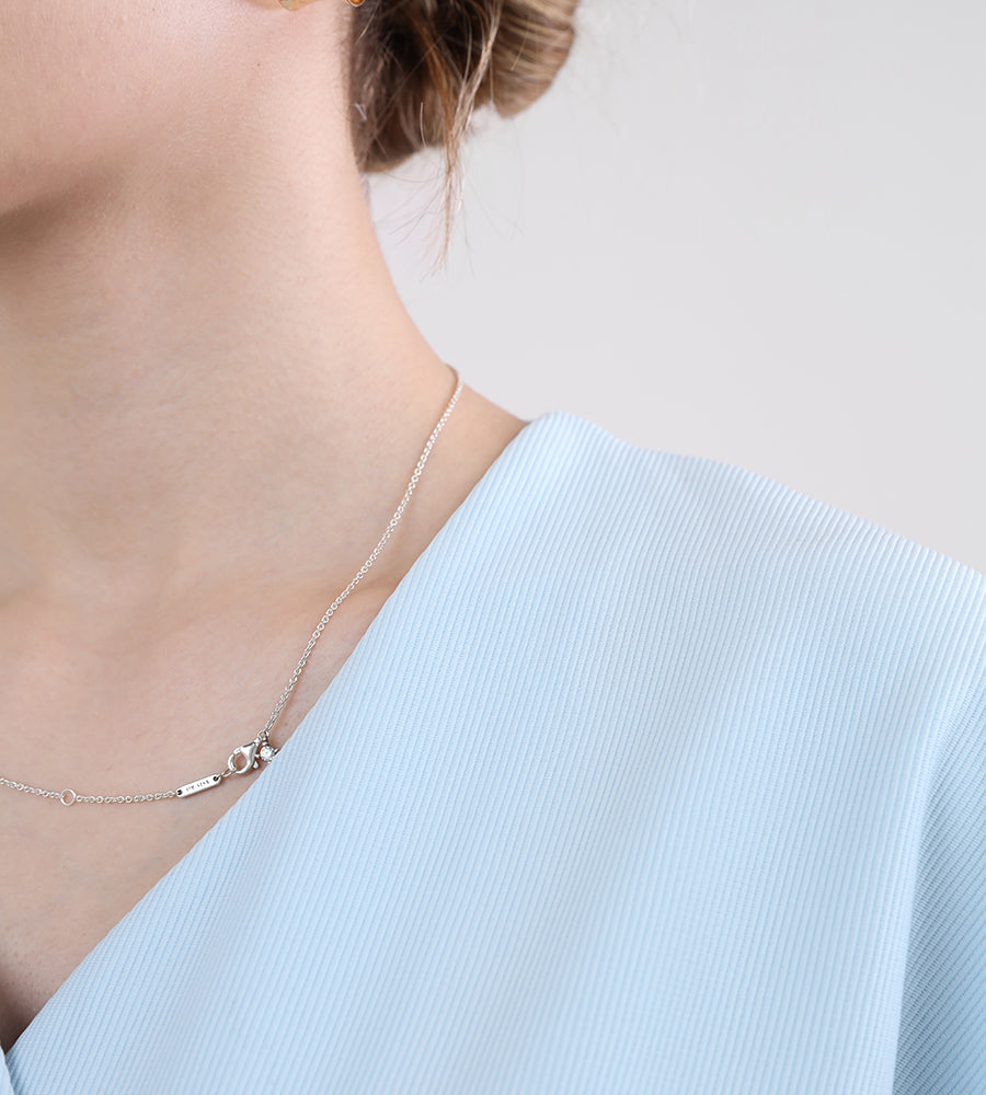 Short-sleeved blouse with gold buttons and trousers set