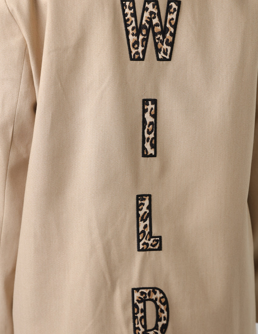 Beige oversized blazer with "WILD"