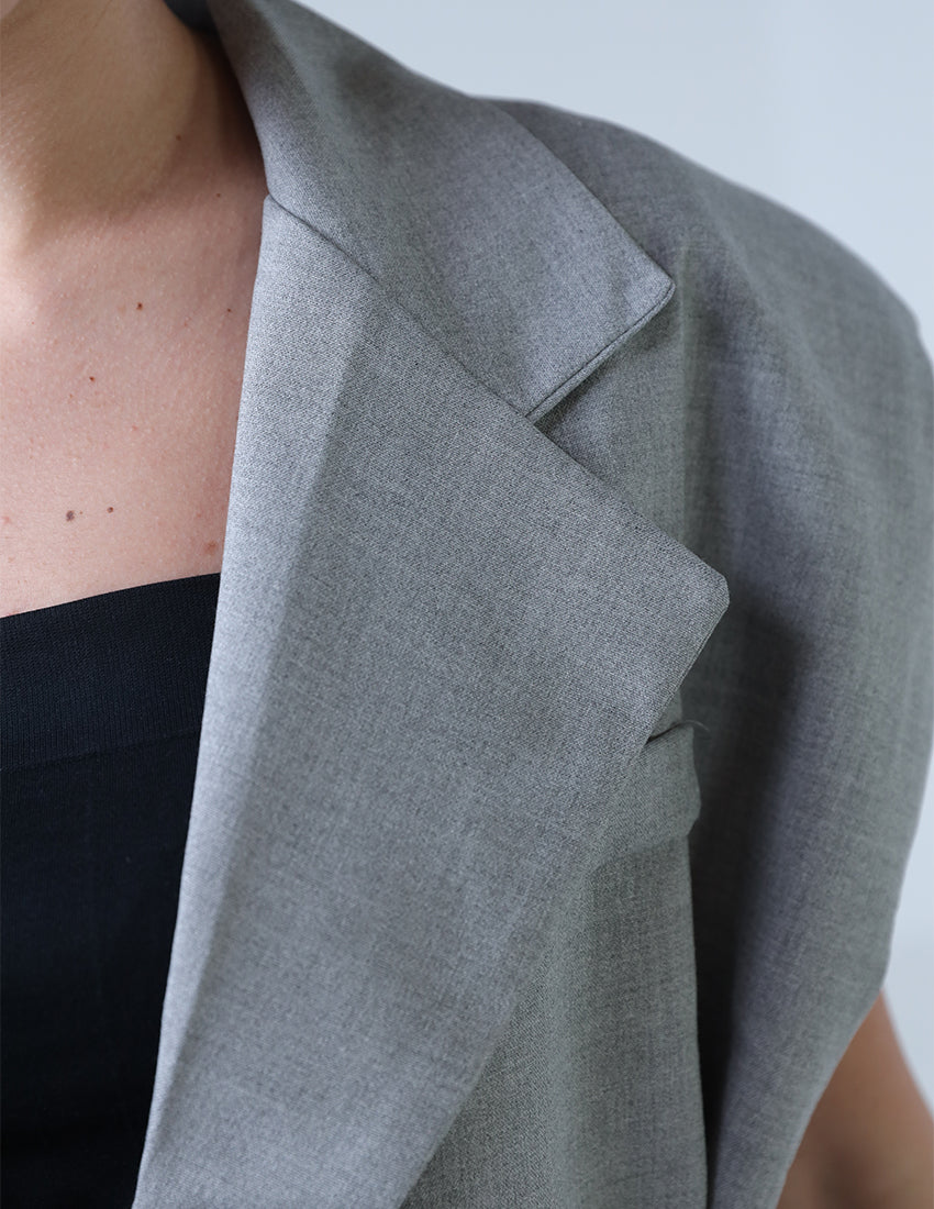 Oversized vest with black belt