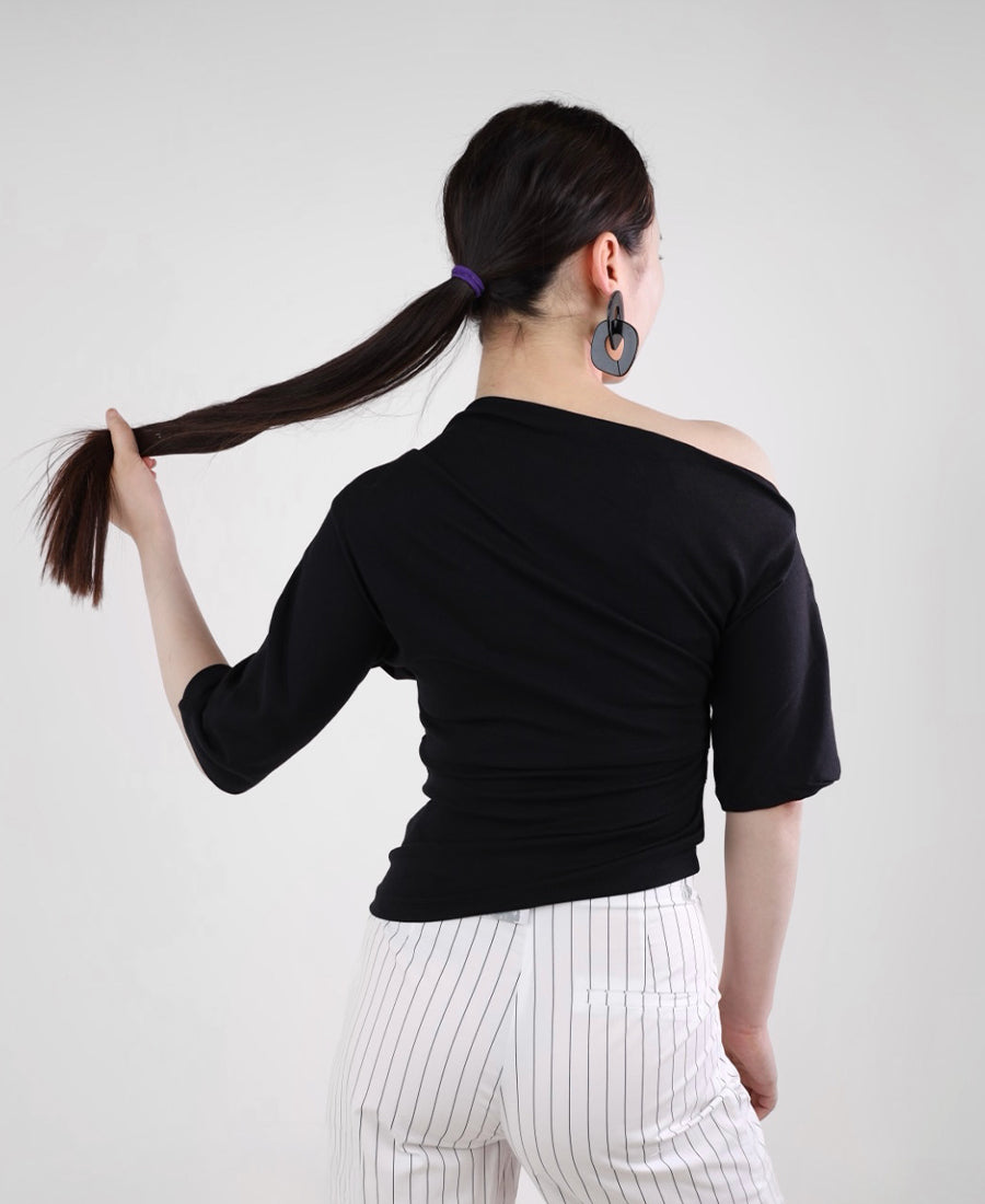 Black T-shirt with a slanted neckline and a gathered waist