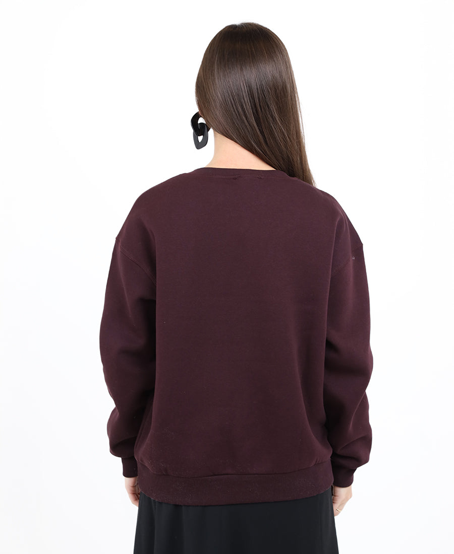 Maroon sweater with printed words