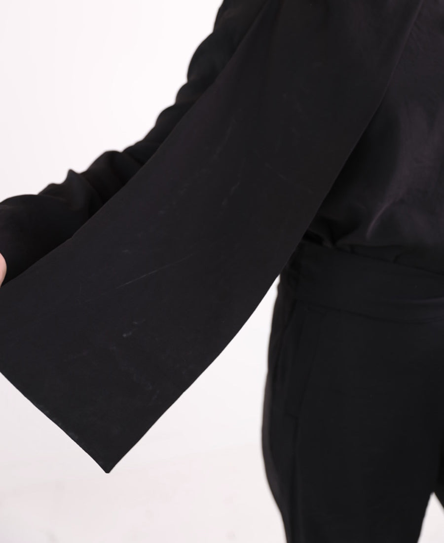 Black set of blouse with tie shoulder buttons and wide leg pants with tie waist