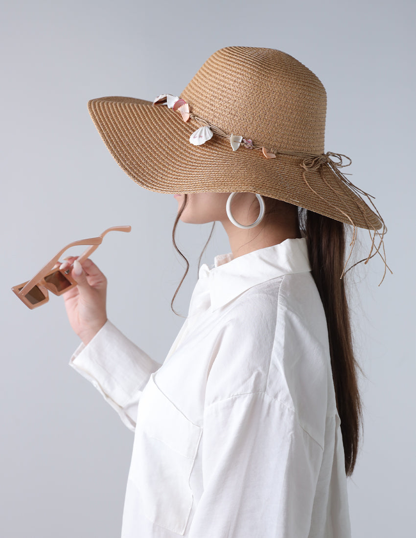 Dark beige priest's hat with a seashell tie
