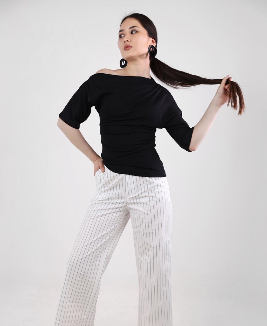 Black T-shirt with a slanted neckline and a gathered waist