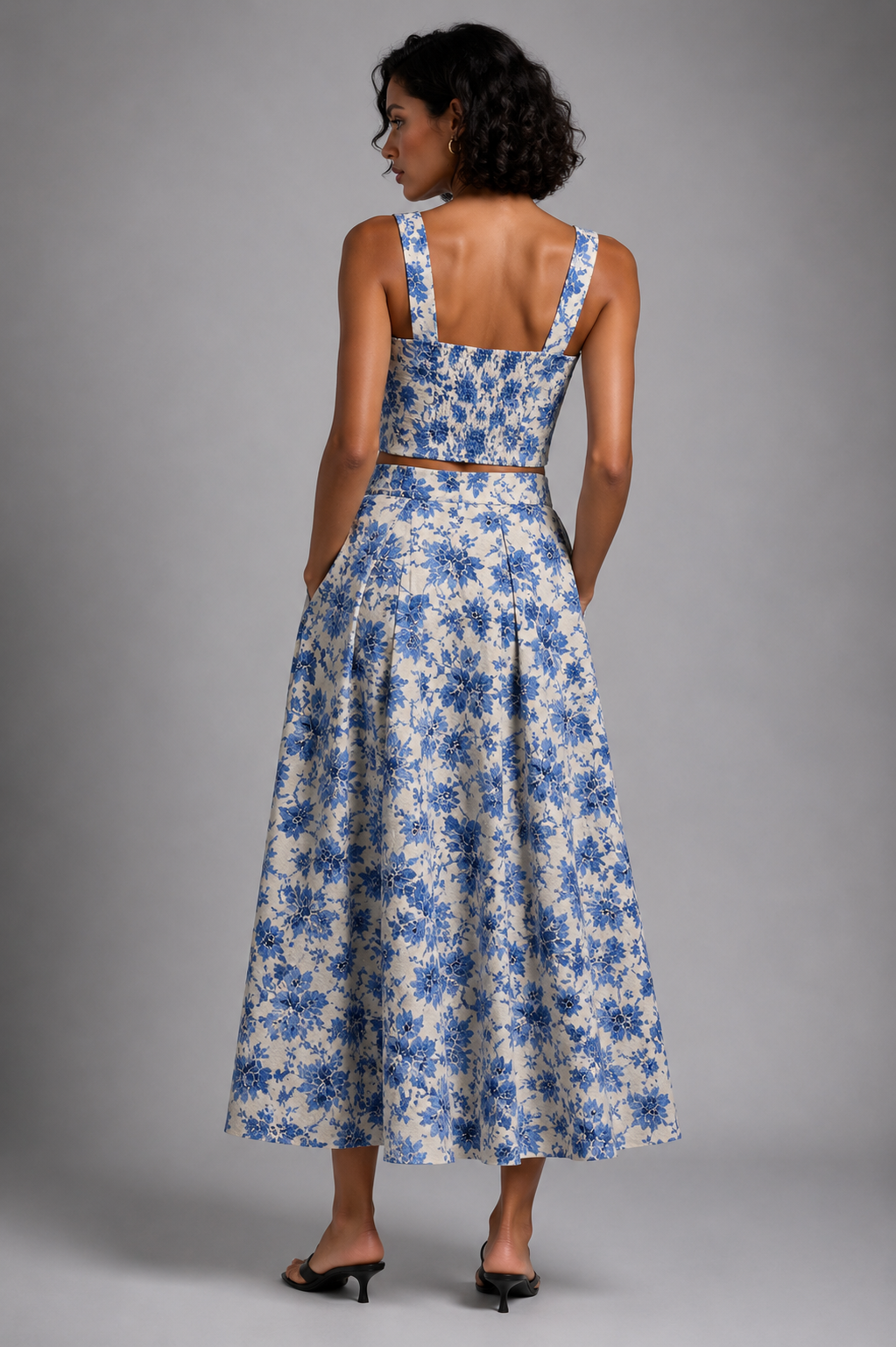 Blue floral set featuring a sleeveless crop top and a midi skirt.