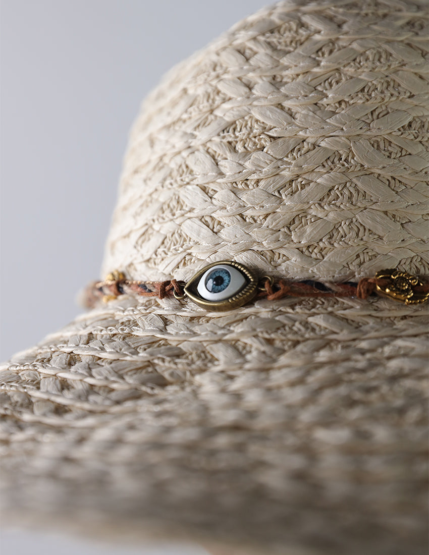 Beige priest's hat with eye patch