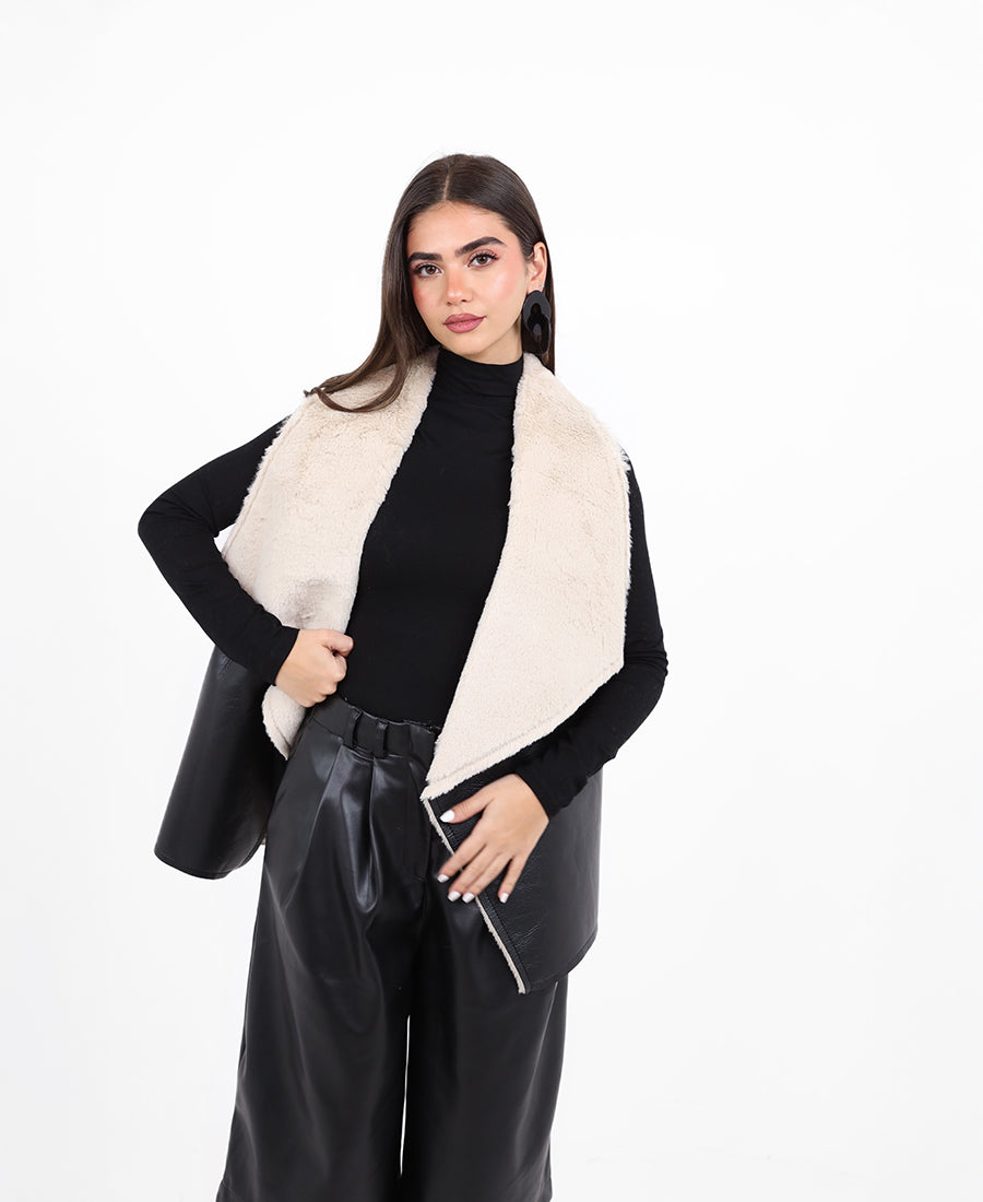 Leather vest on the outside and fur on the inside