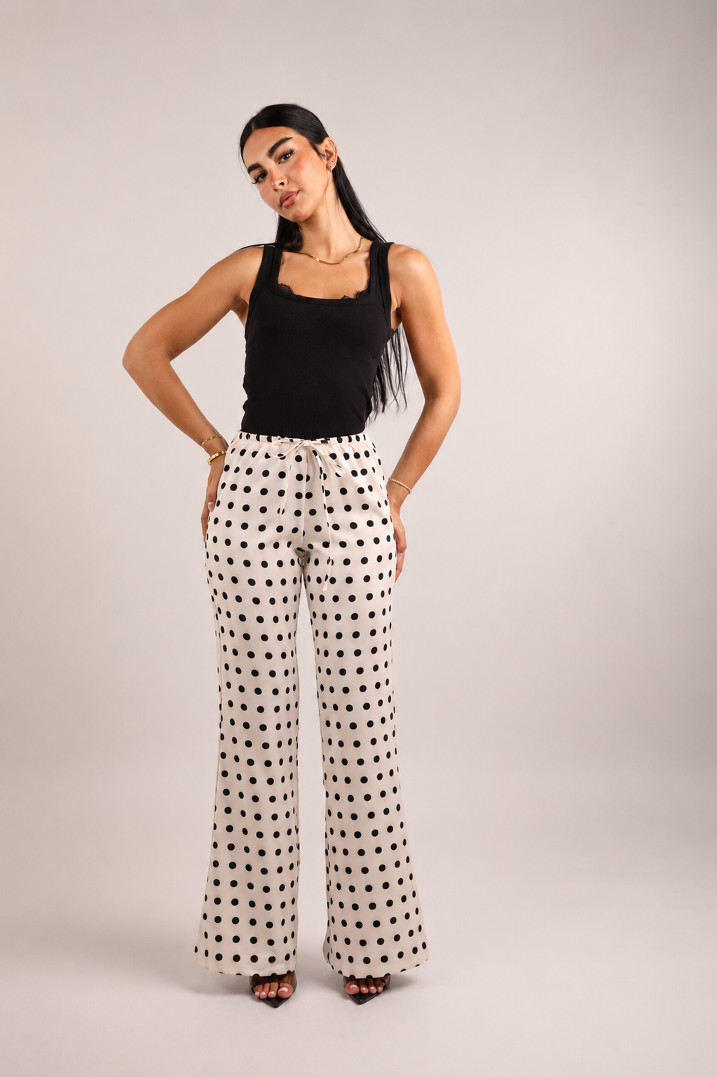 Black and white polka dot satin trousers