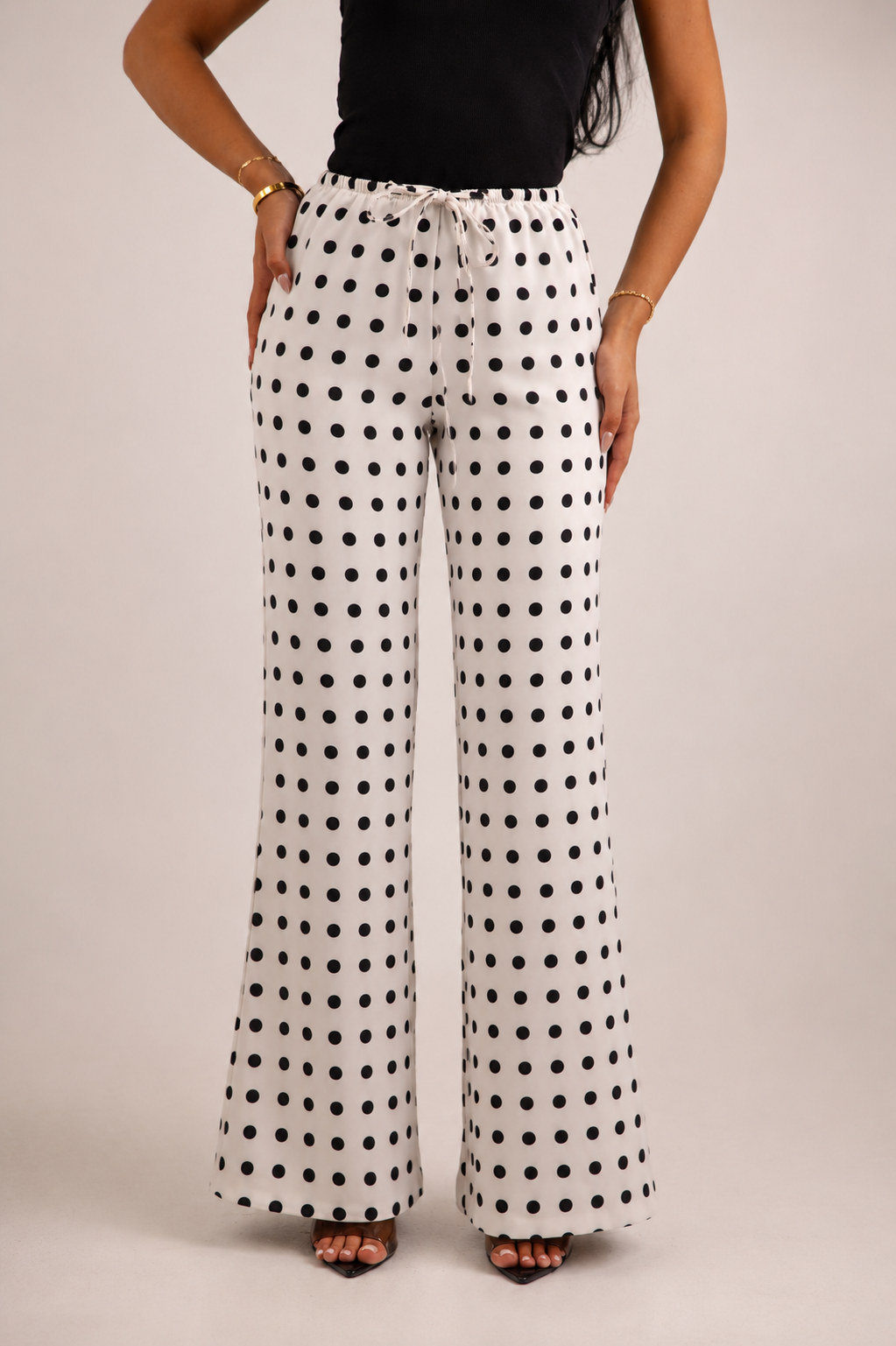 Black and white polka dot satin trousers
