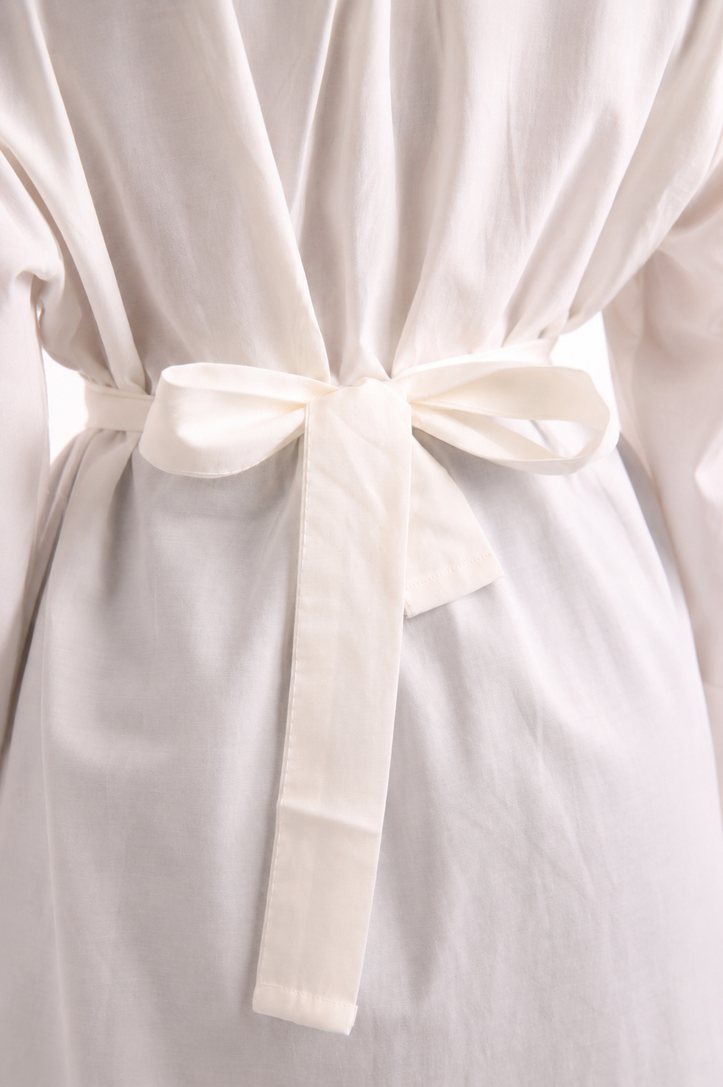V-neck blouse adorned with shimmering roses, tie waist