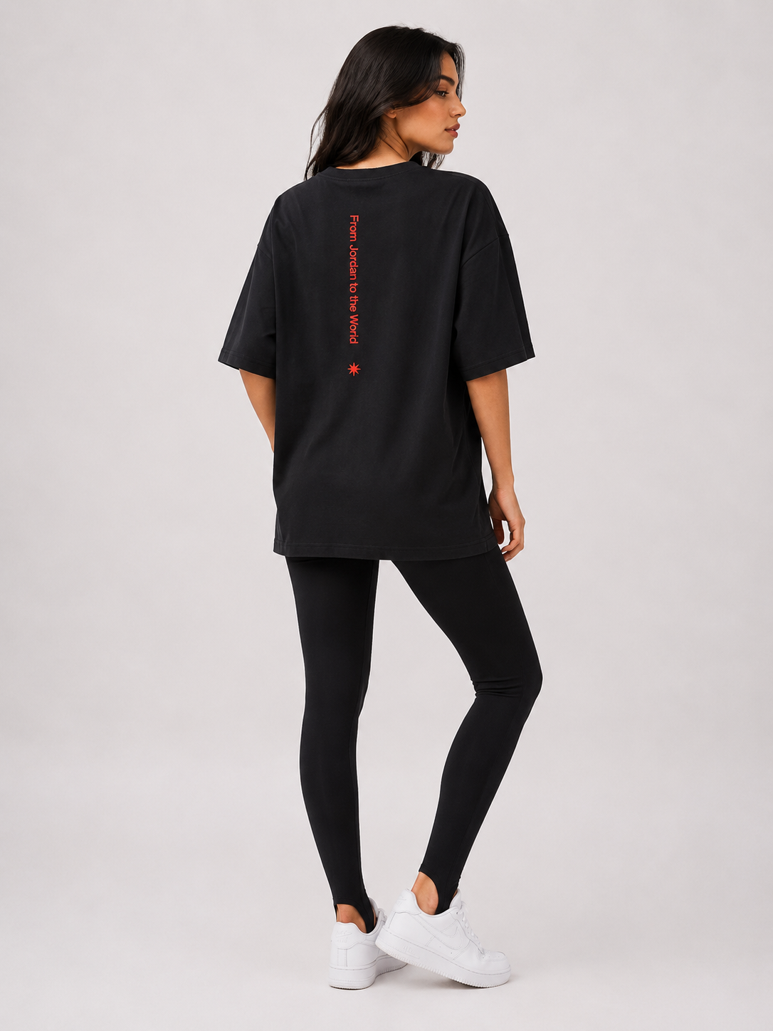 Oversized black t-shirt with the words "From Jordan to the World" and a red star on it.