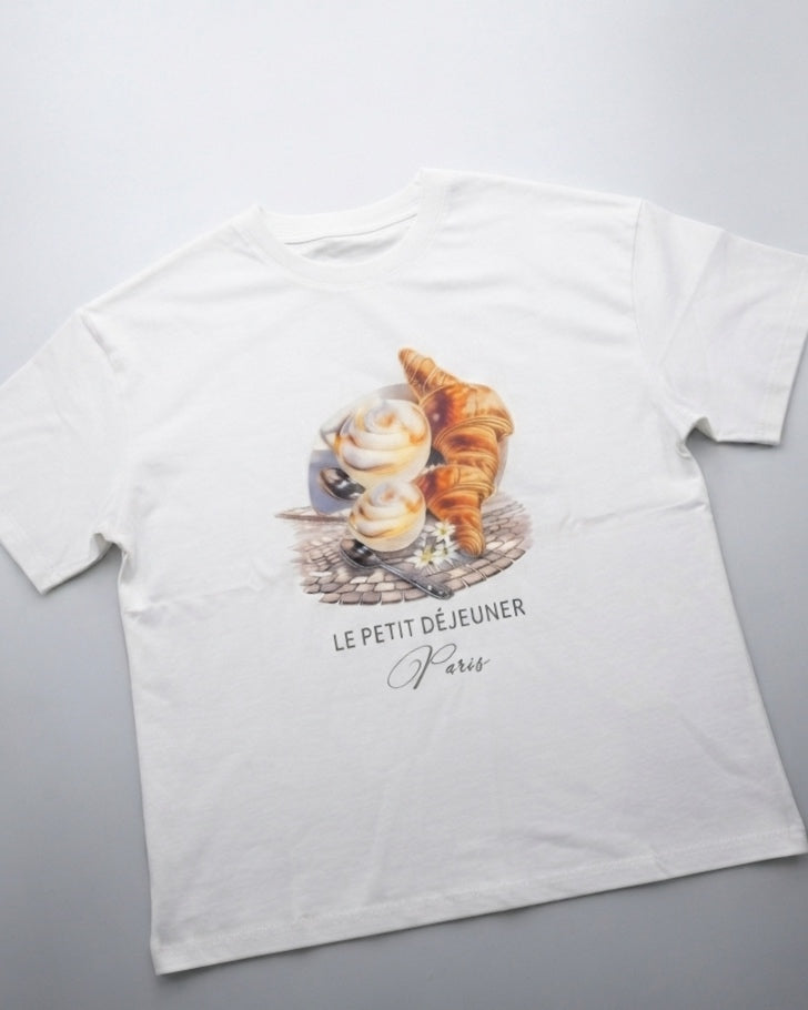 White oversized T-shirt with a croissant design.