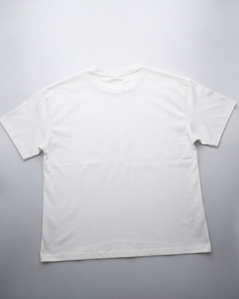 White oversized T-shirt with a croissant design.