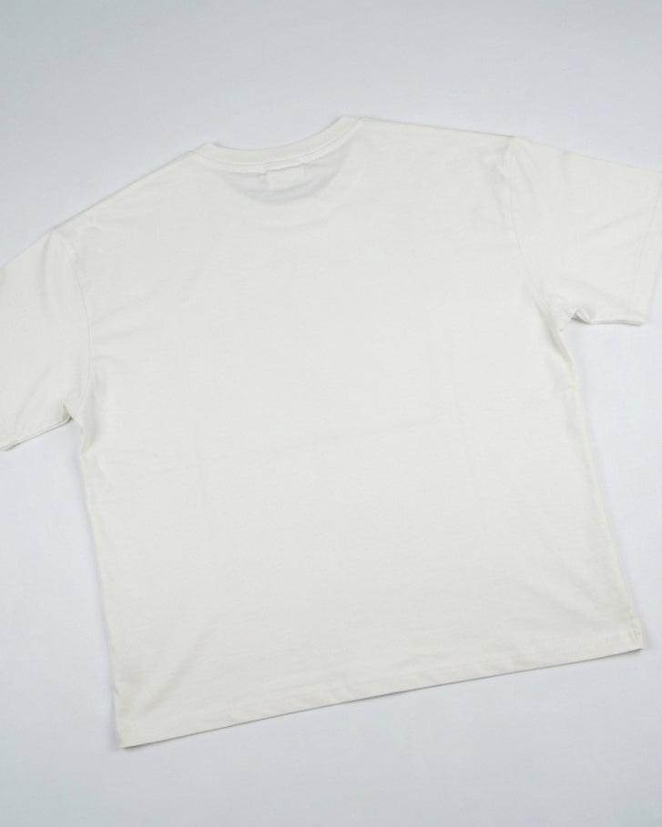 Oversized T-shirt with a seashell graphic.