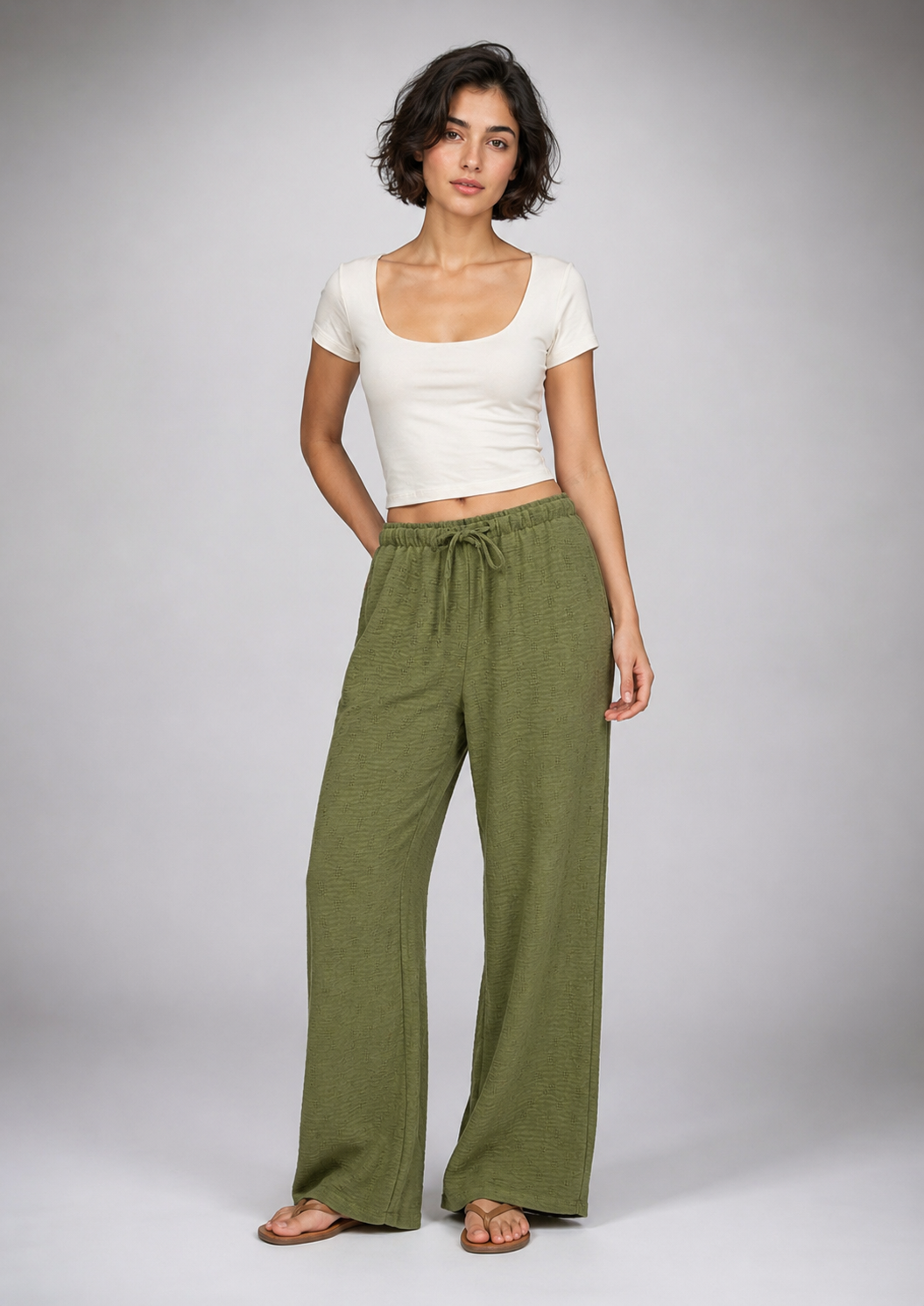 Straight-leg linen trousers with eyelet details