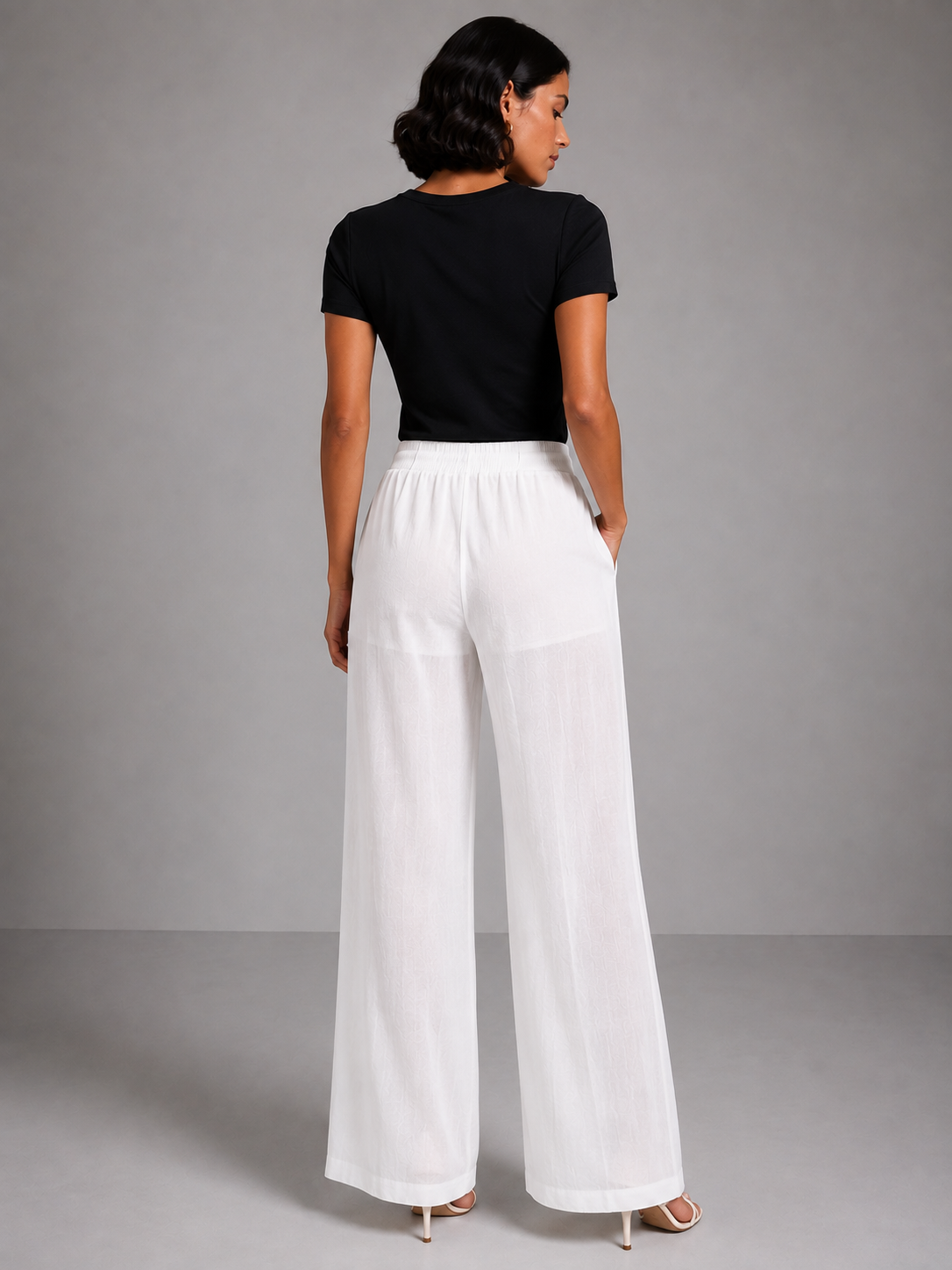 Wide-leg trousers with a tie waist and pleats.