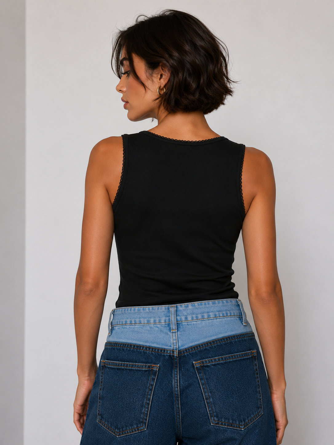Black square-neck top with a small bow.