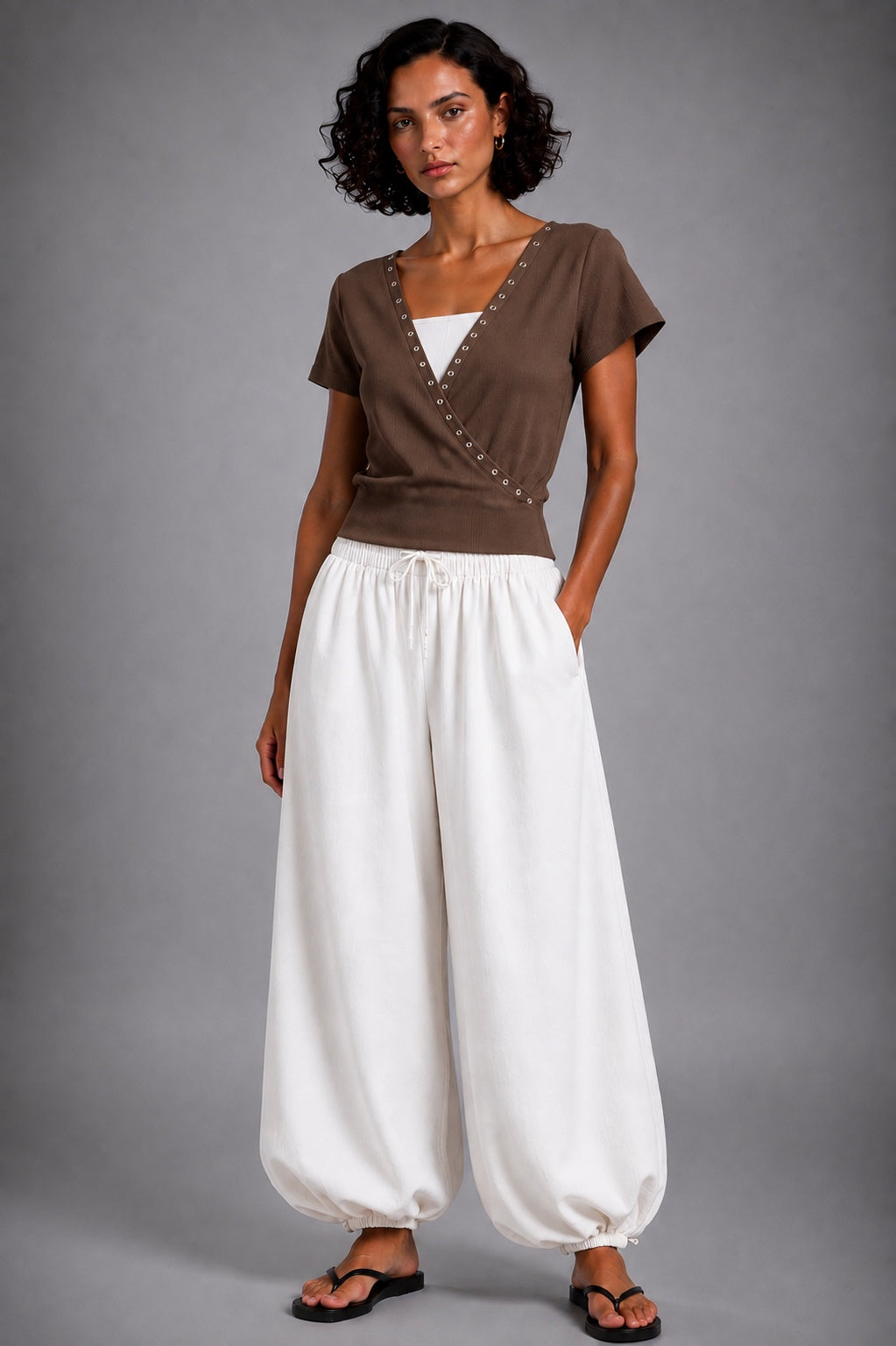 Balloon-cut harem trousers featuring a comfortable elastic waist and wide legs finished with elasticated cuffs.