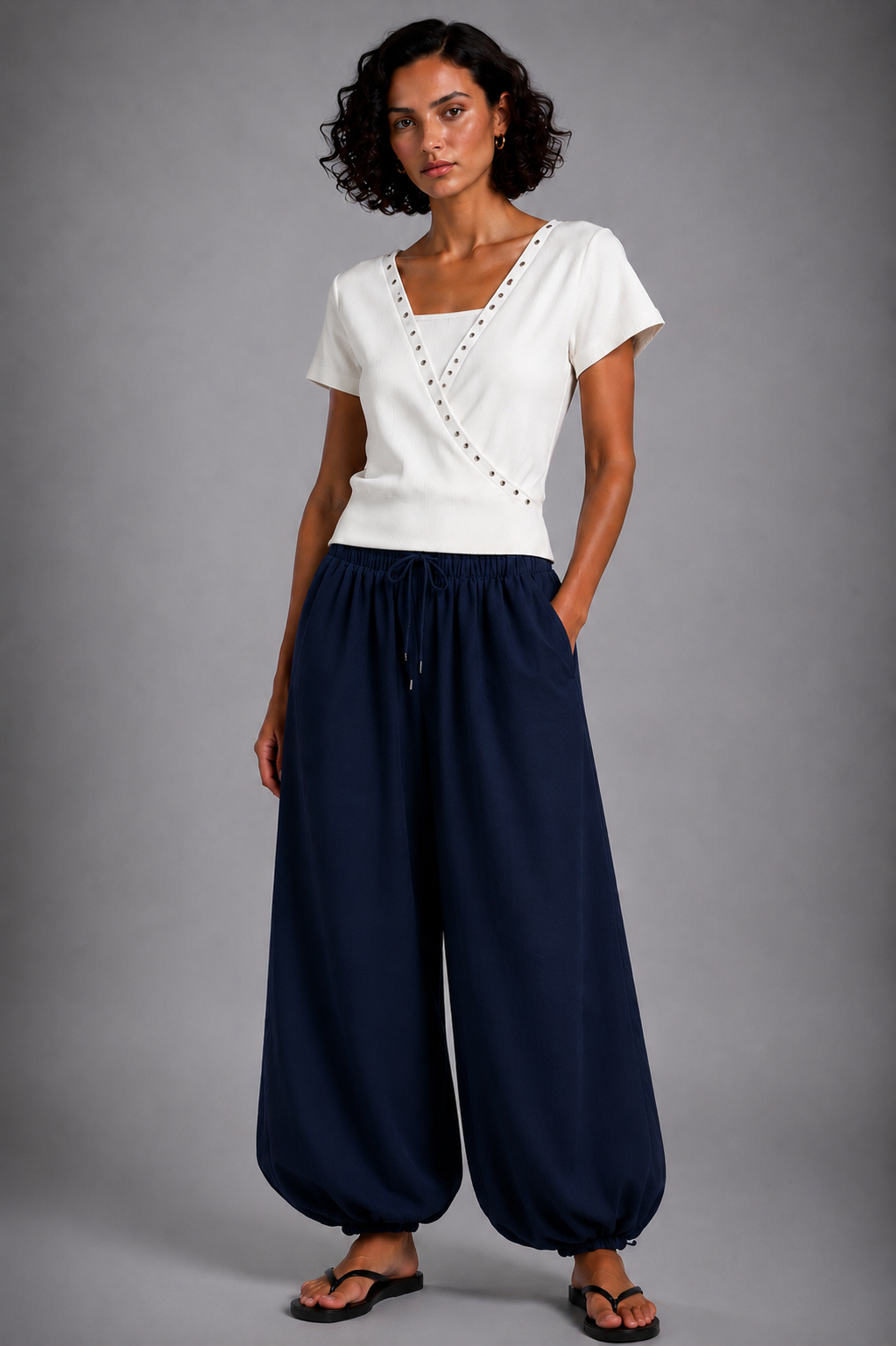 Balloon-cut harem trousers featuring a comfortable elastic waist and wide legs finished with elasticated cuffs.