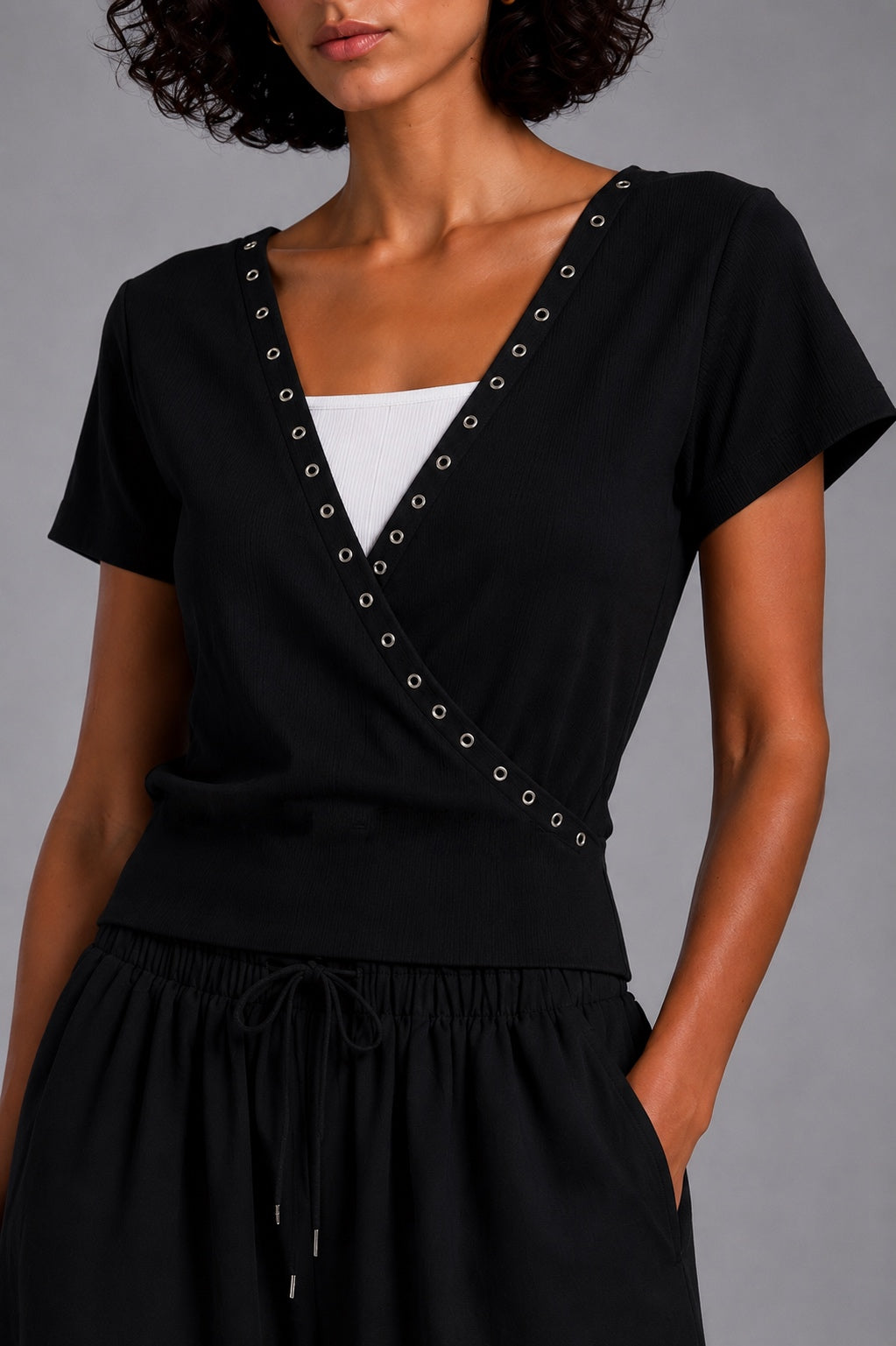 Short-sleeve V-neck top with metal rings
