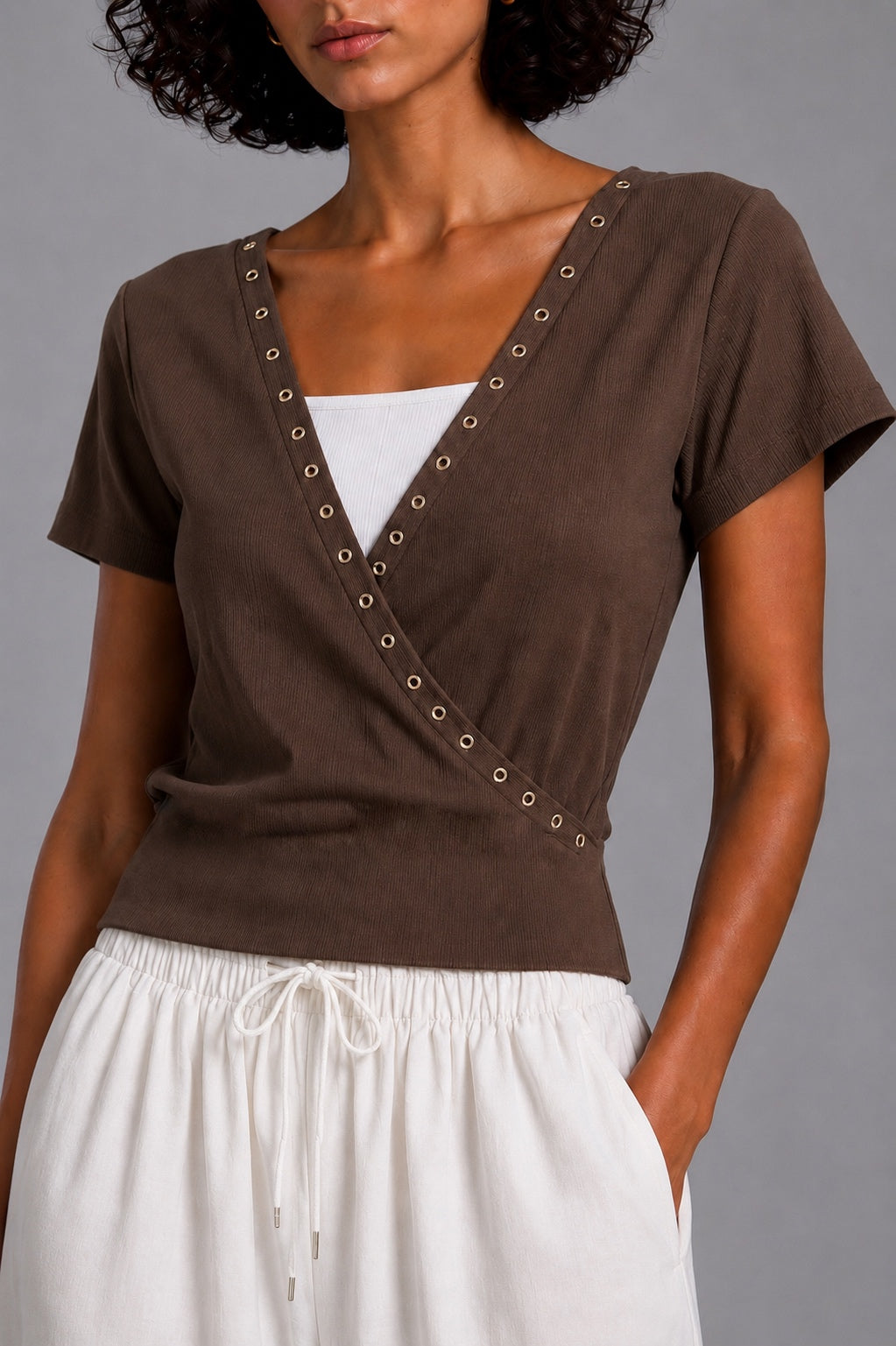 Short-sleeve V-neck top with metal rings