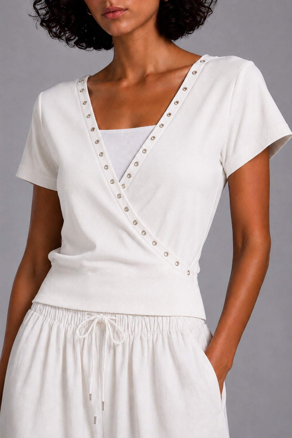 Short-sleeve V-neck top with metal rings