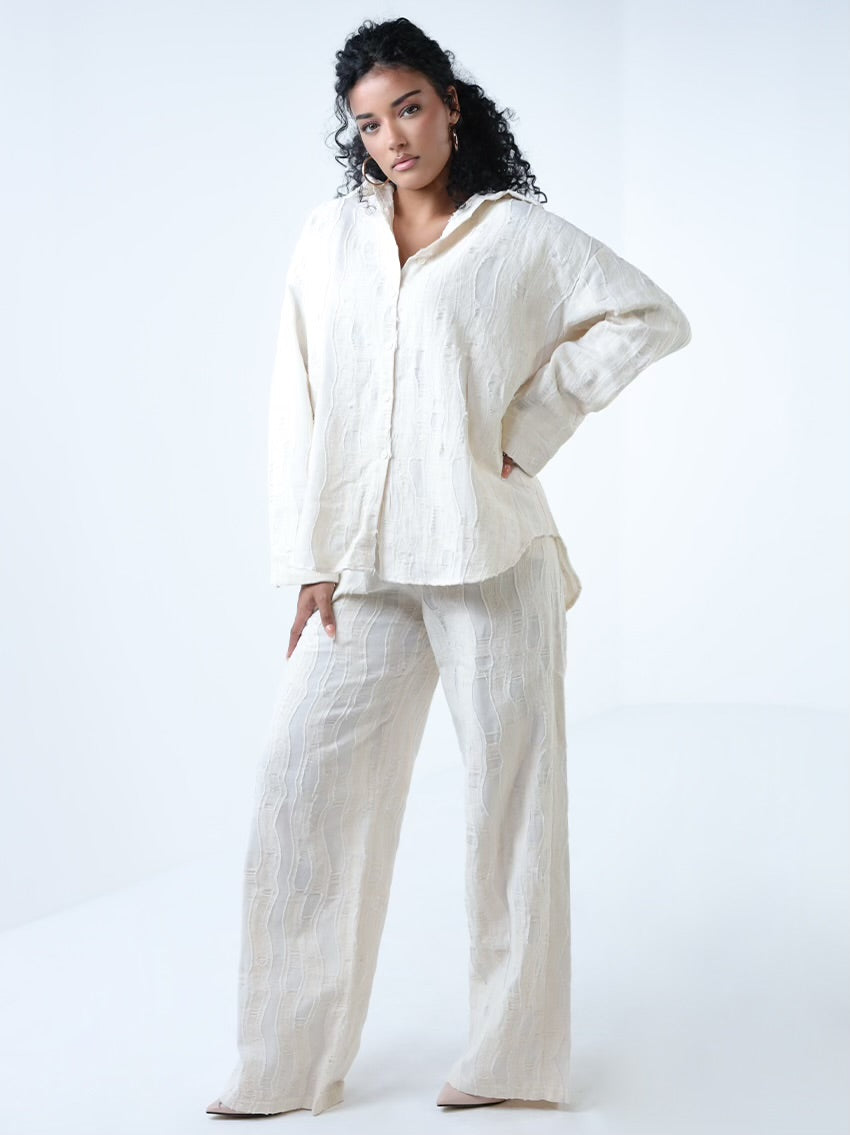 طقم من قطعتين بتفاصيل ممزقة