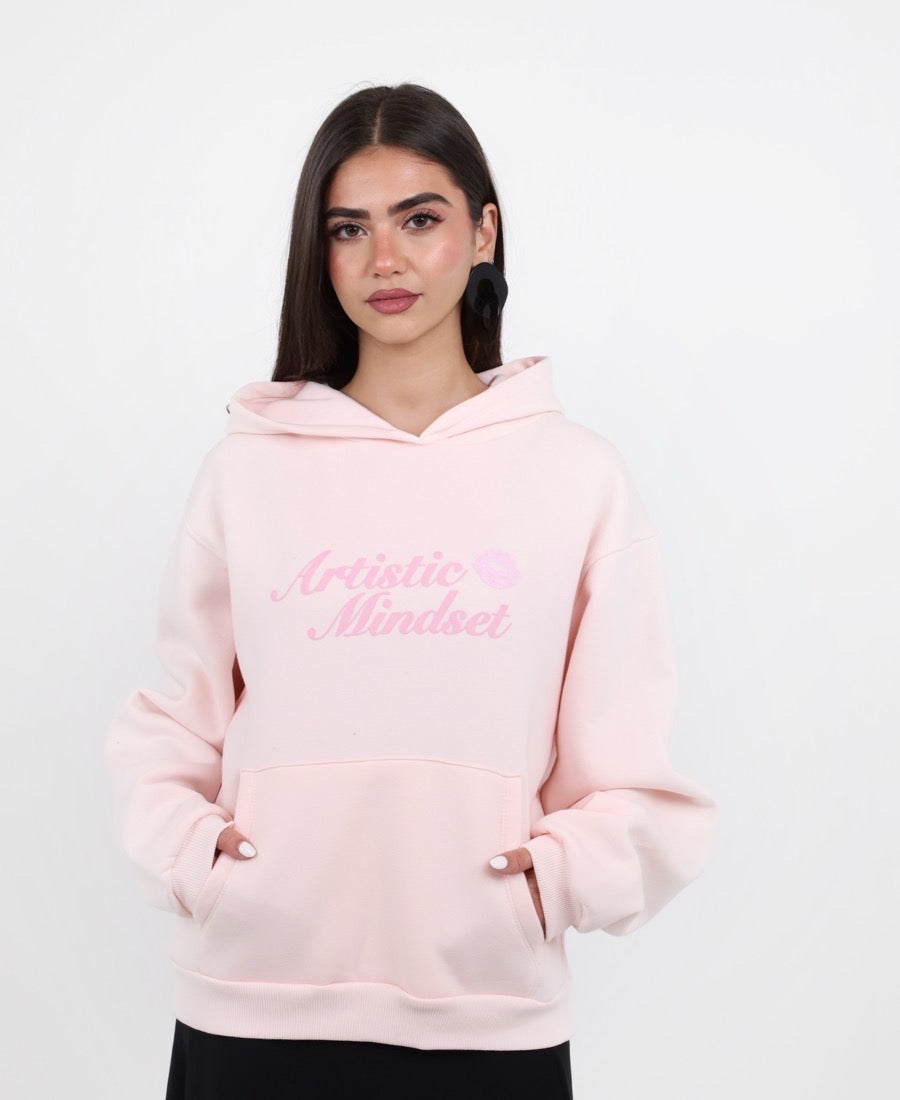 Strawberry hoodie with a kiss-themed message.