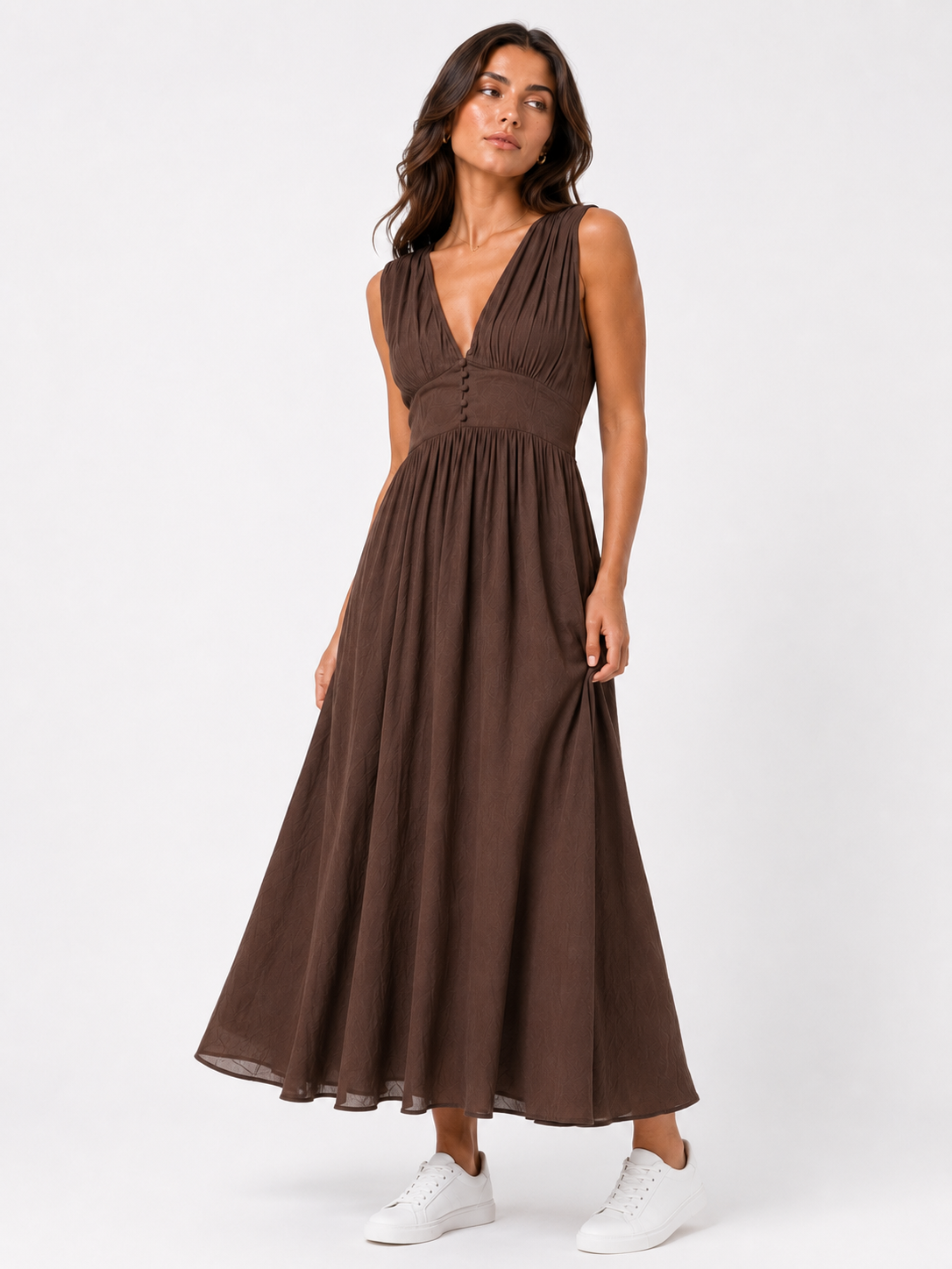 Long sleeveless dress with a button-front bodice.