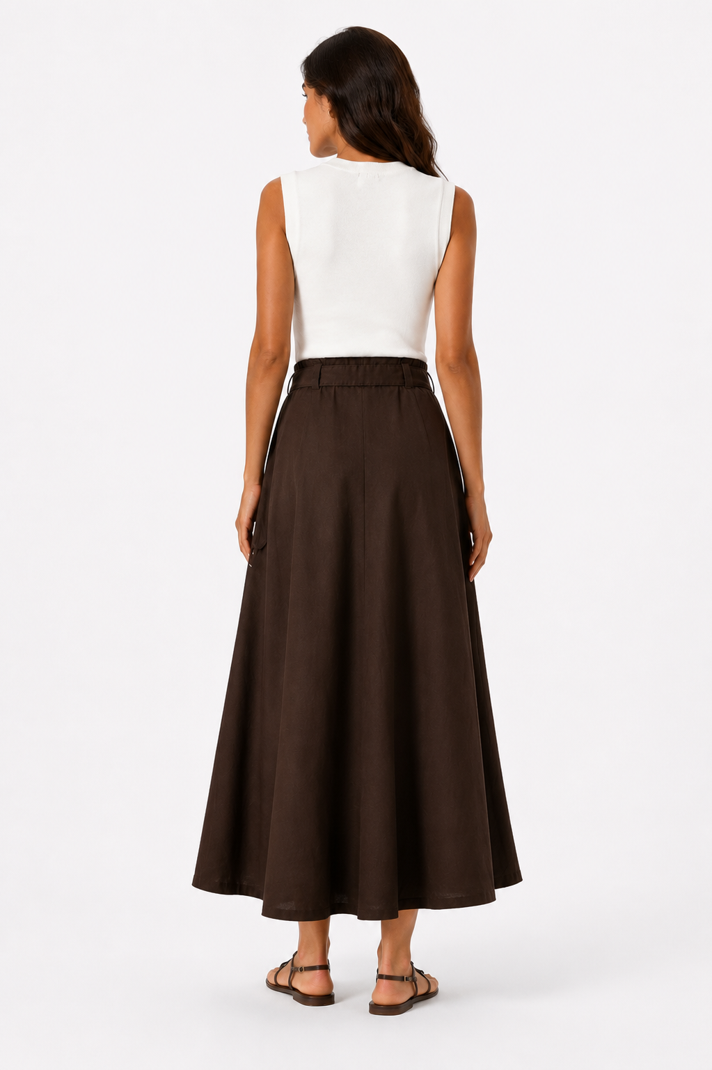 Sleeveless long dress in off-white and brown, featuring a belt.