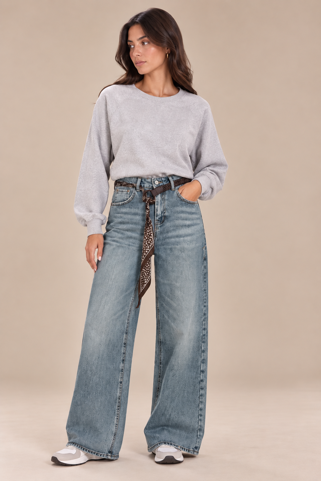 Straight-leg jeans with a brown belt and scarf