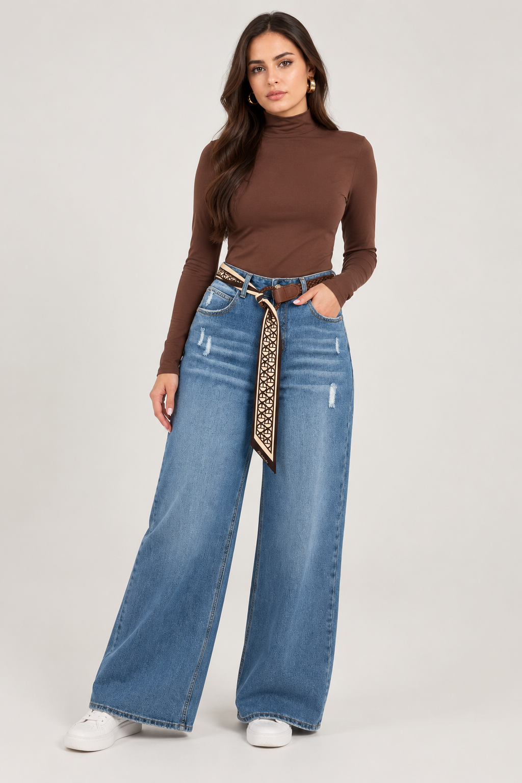 Wide leg dark blue jeans with a brown leather belt and scarf