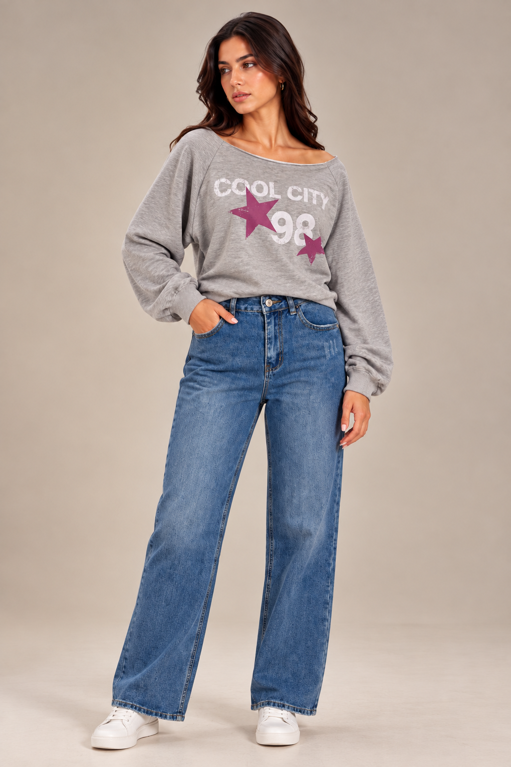 Straight-leg jeans with distressed details on the front.