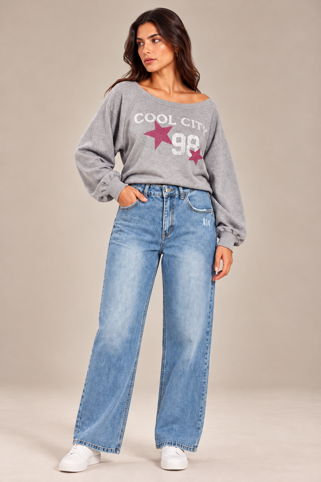 Straight-leg jeans with distressed details on the front.