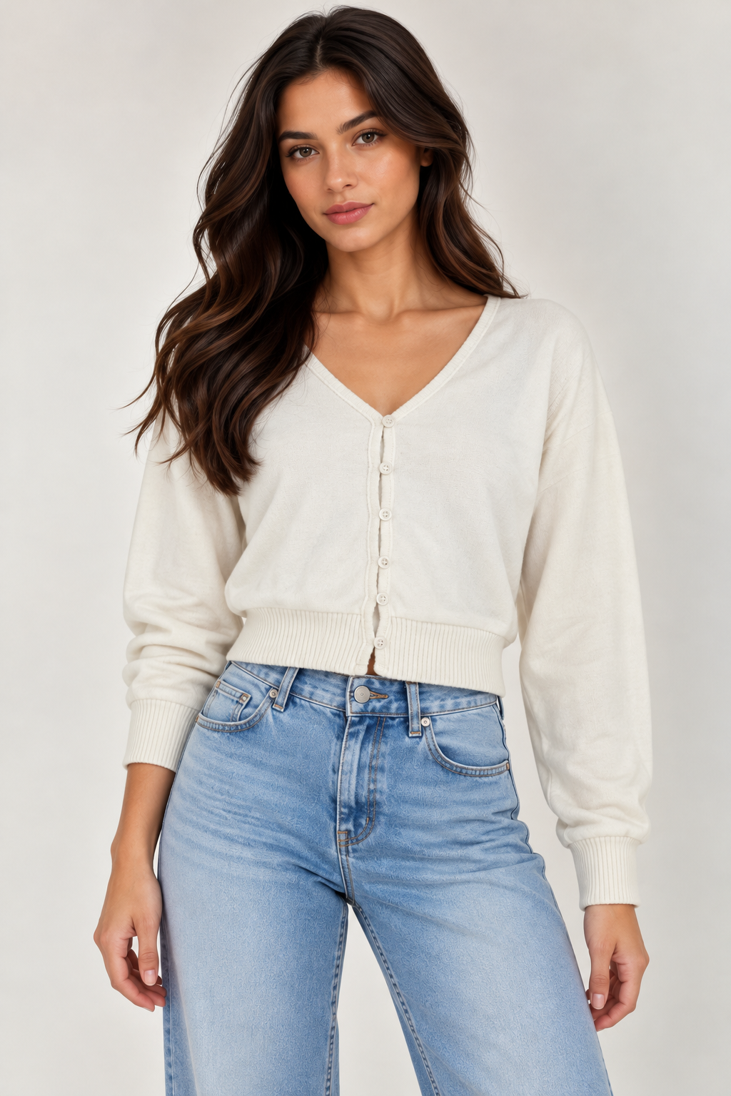 Wool cardigan with a V-neck and button closure.
