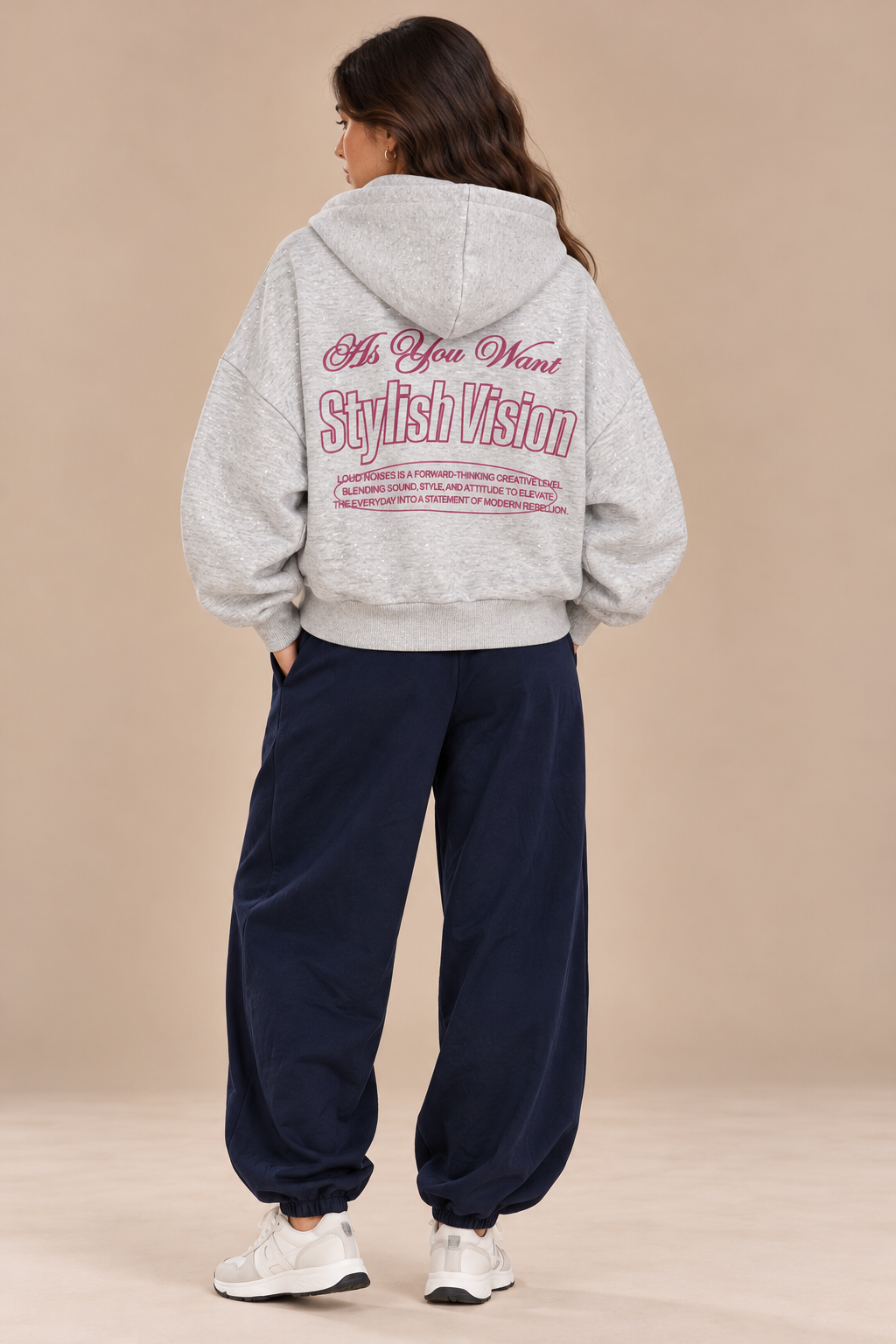 A shiny gray jacket with writing on the front and back, and a hood.