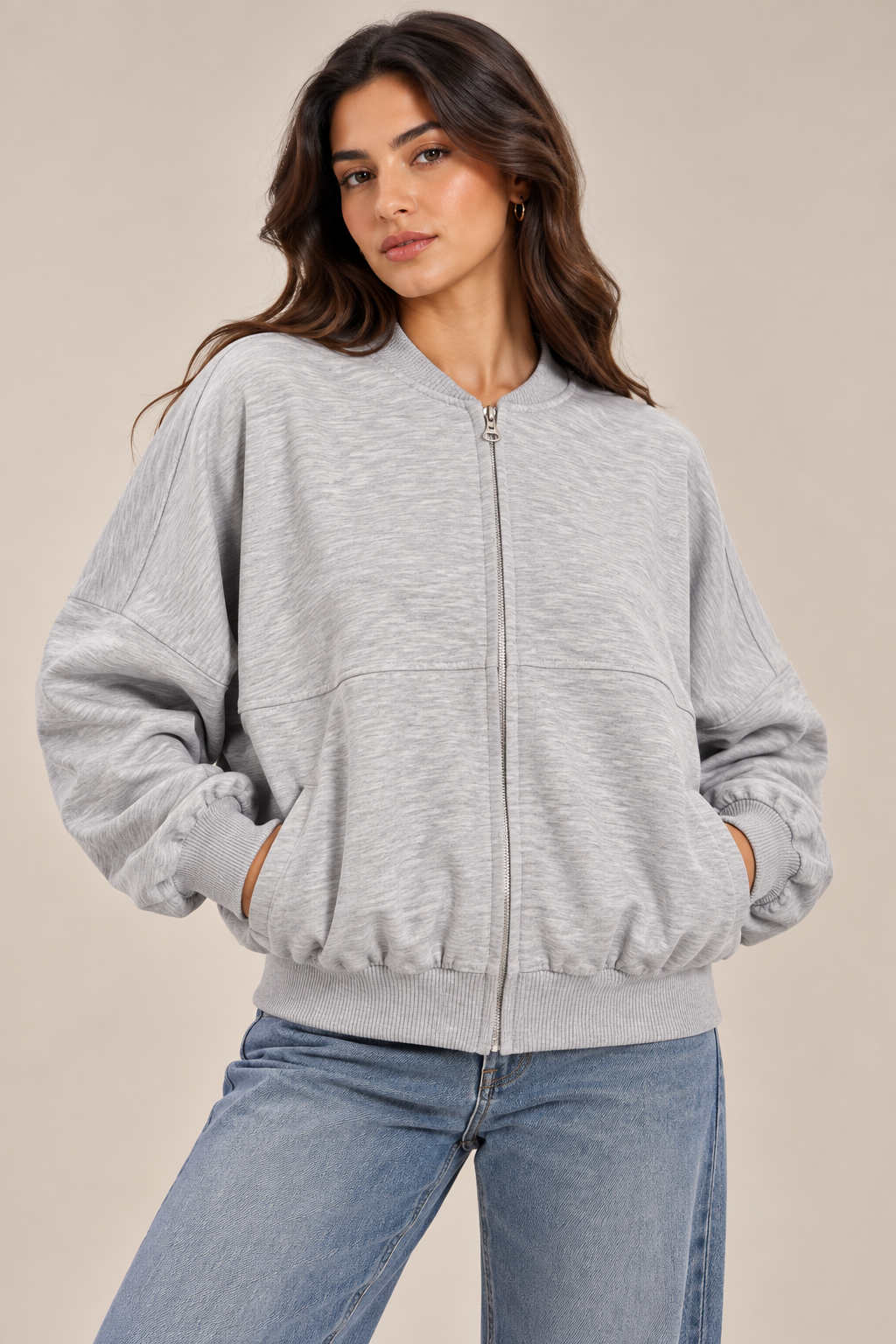 Oversized sweatshirt with a center front stripe, zip closure, and front pocket.