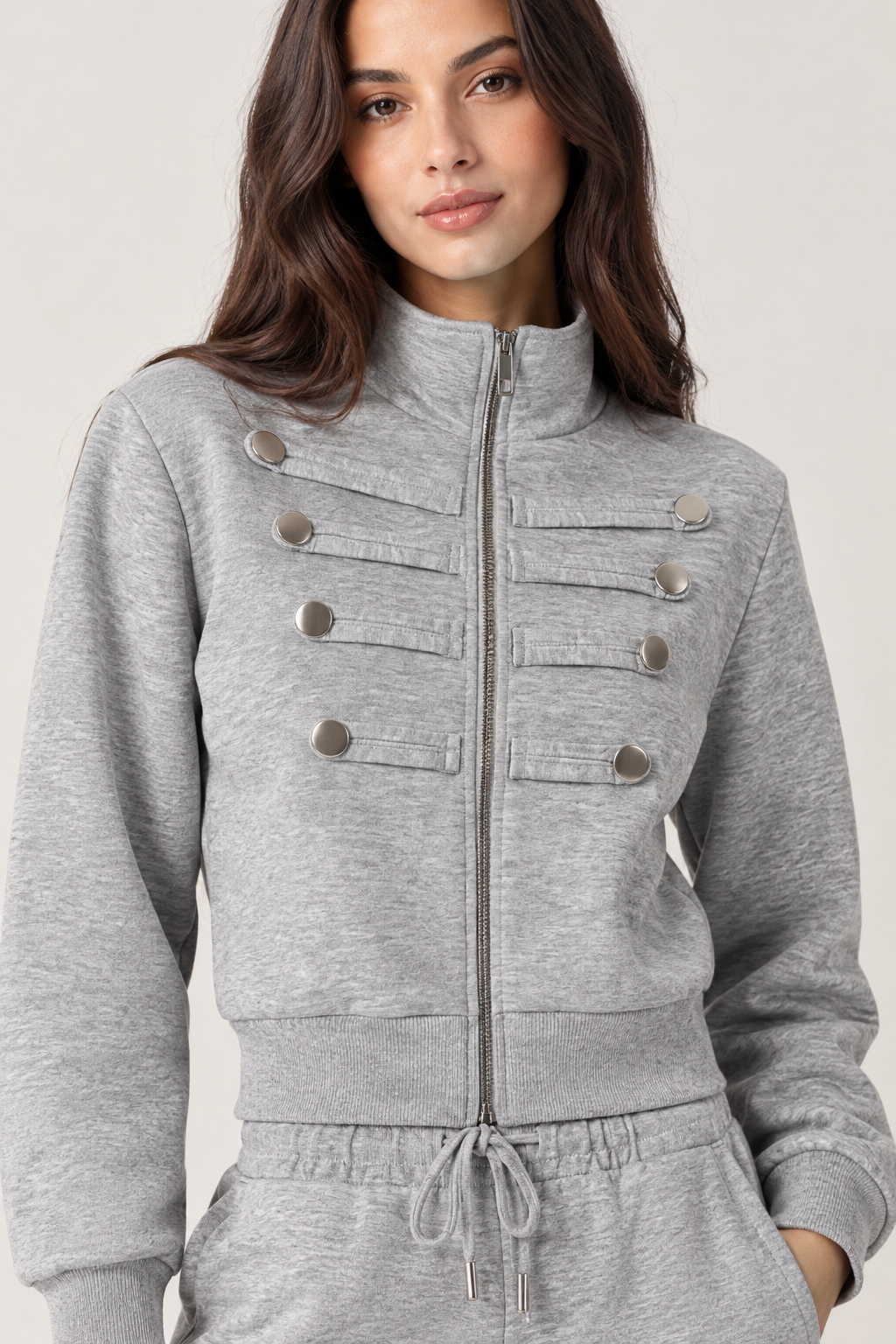 Chinese-style sweatshirt with silver buttons and a zippered front.