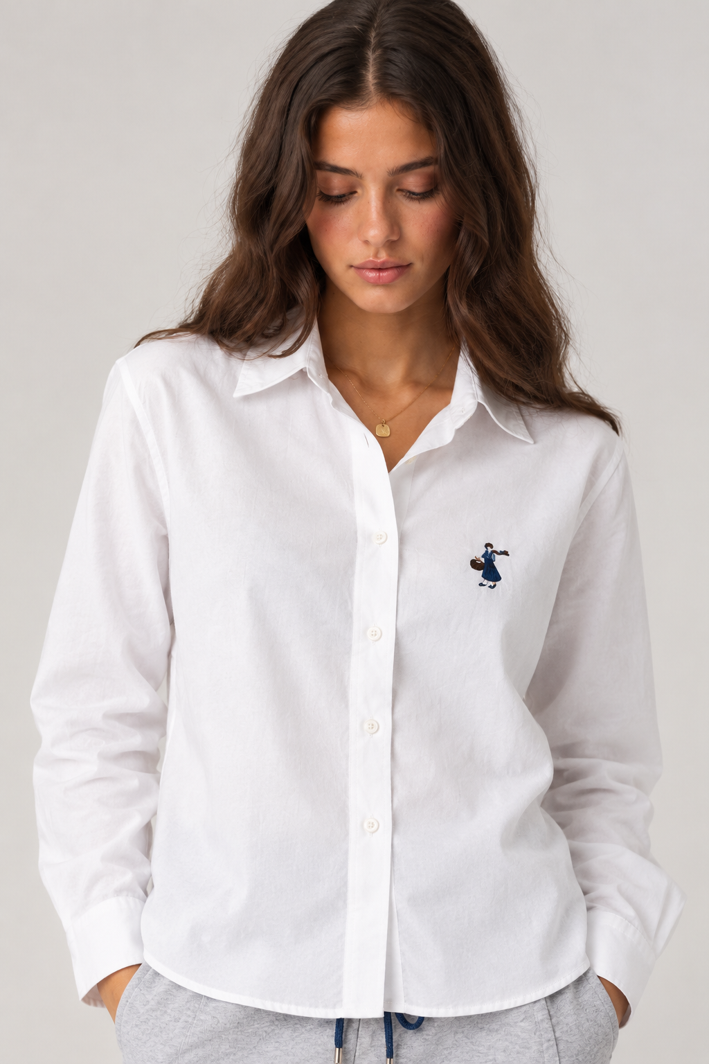White shirt with a small girl's drawing on the side