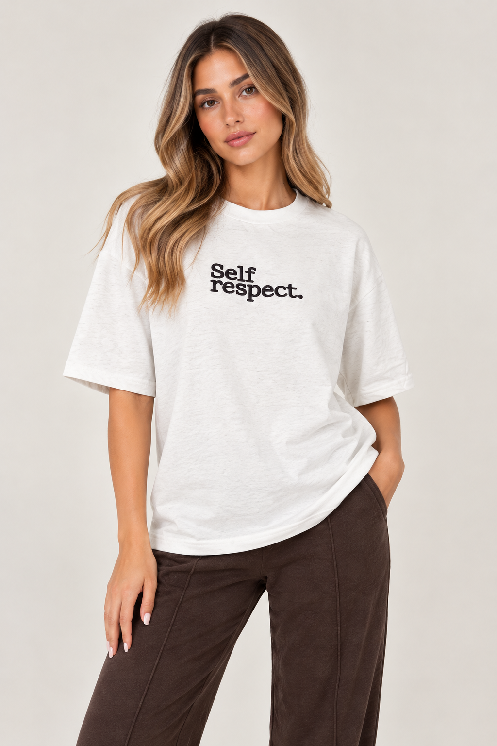 Oversized white t-shirt with "Self respect." in brown