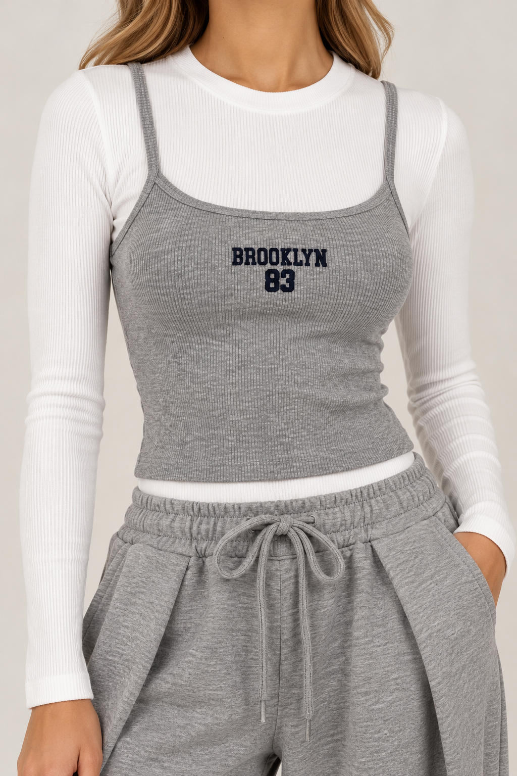 White body top with sleeves and gray tank top "BROOKLYN83" in navy