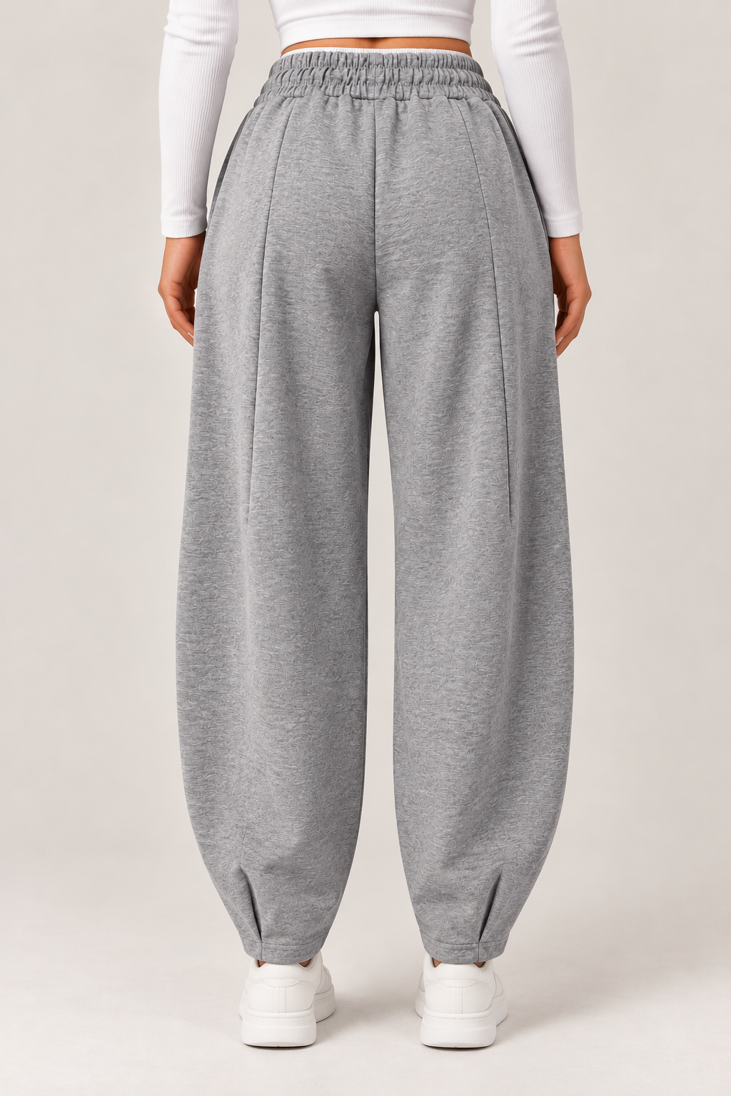 Wide leg sweatpants with an elasticated waistband, gray with a white waistband and the words "BROOKLYN83" in navy.