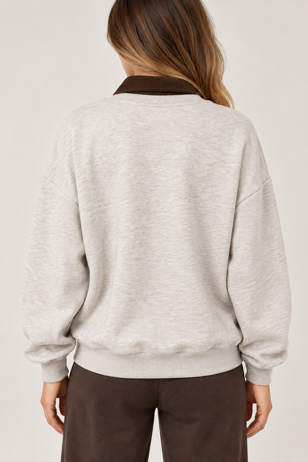 Oversized beige blouse with a brown suede shirt collar and the words "AMORE CLUB" written on the chest in brown.